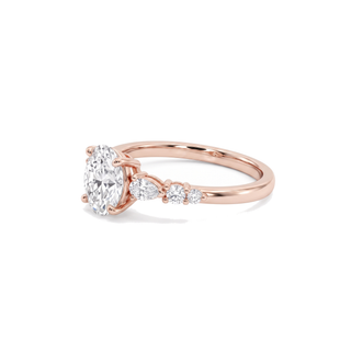 Bague Dauphine, diamant ovale épaulé de diamants poires et ronds, or rose 18 carats — Maison Laveran Paris