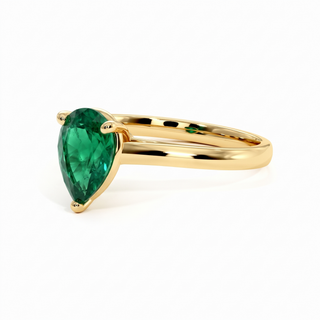 Montaigne Ring, pear-cut synthetic emerald (lab-created stone), three-quarter view, 18k yellow gold — Maison Laveran Paris