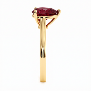 Montaigne Ring, pear-cut synthetic ruby (lab-created stone), profile view, 18k yellow gold — Maison Laveran Paris