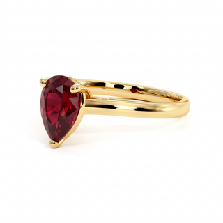 Montaigne Ring, pear-cut synthetic ruby (lab-created stone), three-quarter view, 18k yellow gold — Maison Laveran Paris