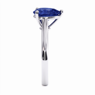 Montaigne Ring, pear-cut synthetic blue sapphire (lab-created stone), profile view, 18k white gold or 950 platinum — Maison Laveran Paris