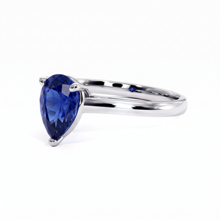 Montaigne Ring, pear-cut synthetic blue sapphire (lab-created stone), three-quarter view, 18k white gold or 950 platinum — Maison Laveran Paris