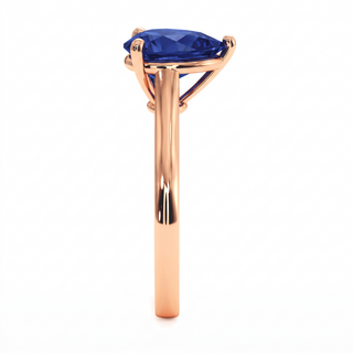 Montaigne Ring, pear-cut synthetic blue sapphire (lab-created stone), profile view, 18k rose gold — Maison Laveran Paris