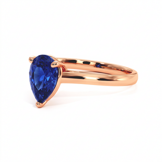 Montaigne Ring, pear-cut synthetic blue sapphire (lab-created stone), three-quarter view, 18k rose gold — Maison Laveran Paris