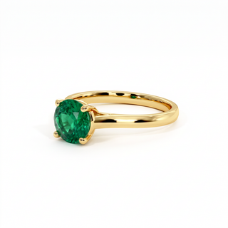 Montaigne Ring, round-cut synthetic emerald (lab-created stone), three-quarter view, 18k yellow gold — Maison Laveran Paris