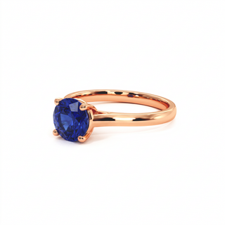 Montaigne Ring, round-cut synthetic blue sapphire (lab-created stone), three-quarter view, 18k rose gold — Maison Laveran Paris